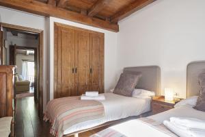 Posteľ alebo postele v izbe v ubytovaní Luderna - Apartamento Centelha