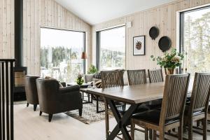 a dining room with a table and chairs at Lovely winter cottage in Vemdalen, close to skiing in Vemdalen