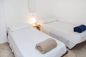Łóżko lub łóżka w pokoju w obiekcie Villa Tina ai Piedi del Faro di Leuca