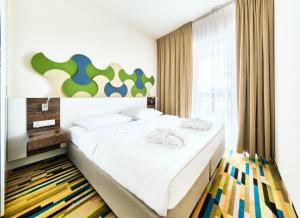 Posteľ alebo postele v izbe v ubytovaní Baltic Park Molo Apartments by Zdrojowa + 37 fotografií