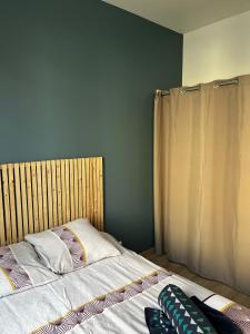 Posteľ alebo postele v izbe v ubytovaní La petite Boutique Bleue