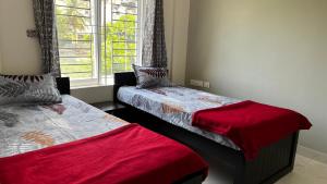 Un pat sau paturi într-o cameră la Annapoorna Residency