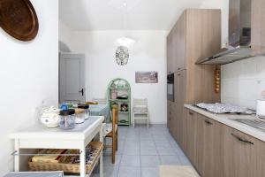 a kitchen with white walls and a white counter top at Marta in Portovenere