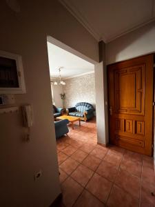 a view of a living room with a door at Cozy Apartment Katerini in Katerini