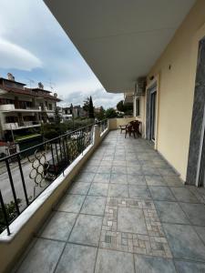 a balcony of a building with a view at Cozy Apartment Katerini in Katerini