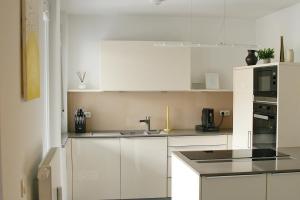 Kuchyň nebo kuchyňský kout v ubytování American Ease Apartments - Hahnbach, Vilseck, Weiden