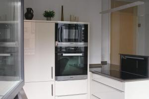 Kuchyň nebo kuchyňský kout v ubytování American Ease Apartments - Hahnbach, Vilseck, Weiden