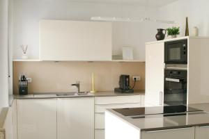 Kuchyň nebo kuchyňský kout v ubytování American Ease Apartments - Hahnbach, Vilseck, Weiden