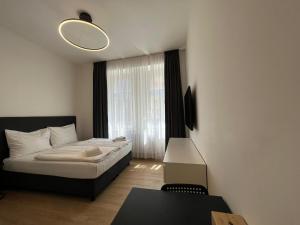 Posteľ alebo postele v izbe v ubytovaní Figaro Suites