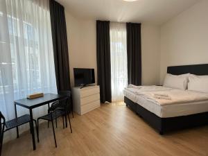Posteľ alebo postele v izbe v ubytovaní Figaro Suites