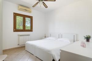 Postel nebo postele na pokoji v ubytování Villa Bella con piscina by Wonderful Italy + 32 fotografií