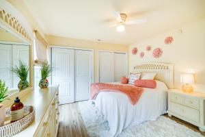a bedroom with a bed and a ceiling fan at Nags Head Vacation Rental with Hot Tub Near Beach! in Nags Head