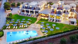 an aerial view of a large house with a swimming pool at Simosmare Resort in Elafonisos