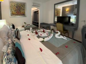 A television and/or entertainment centre at Tiana Beach Resort
