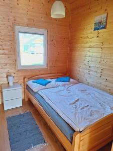 Postel nebo postele na pokoji v ubytování MożeMorze? Ośrodek Domków Letniskowych