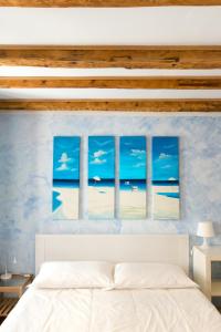 a bedroom with a view of the beach at Piazza Grande City Residence in Trieste