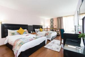 Postel nebo postele na pokoji v ubytování Royal Mirage Fes Hotel