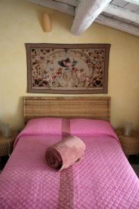 Postel nebo postele na pokoji v ubytování L'Oleandro sul Lago d'Iseo B&B