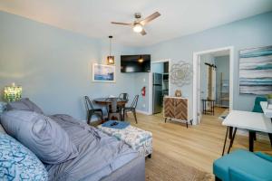 a living room with a couch and a table at Modern Ocean City Getaway Walk to Boardwalk! in Ocean City