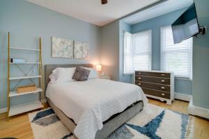 a bedroom with a bed and a dresser and a window at Modern Ocean City Getaway Walk to Boardwalk! in Ocean City