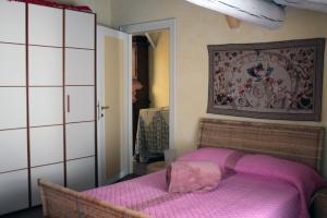 Postel nebo postele na pokoji v ubytování L'Oleandro sul Lago d'Iseo B&B