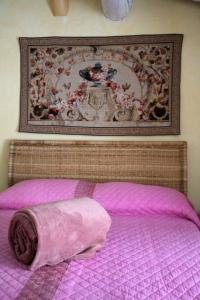 Postel nebo postele na pokoji v ubytování L'Oleandro sul Lago d'Iseo B&B