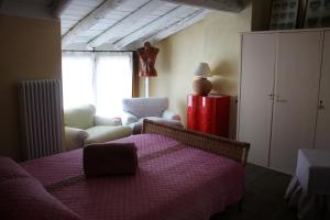 Postel nebo postele na pokoji v ubytování L'Oleandro sul Lago d'Iseo B&B