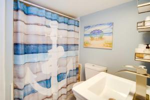 a bathroom with a shower curtain and a sink at Charming Ocean City Apartment Less Than 1 Mi to Boardwalk! in Ocean City +17 photos