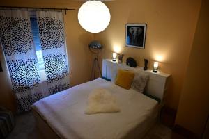 A bed or beds in a room at Balaton Soul House