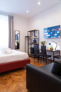 Postel nebo postele na pokoji v ubytování Varese Suites