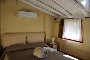 Postel nebo postele na pokoji v ubytování L'Oleandro sul Lago d'Iseo B&B