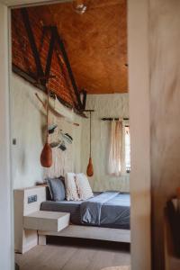 מיטה או מיטות בחדר ב-Arawe Retreat