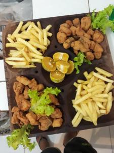a tray of food with french fries and tater tots at MIRANTE DO CERRADO in Nobres