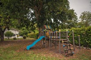 a playground with a slide in a park at casa filippi in Honda