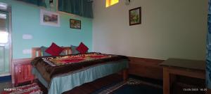 Postel nebo postele na pokoji v ubytování The Moon Light Home stay