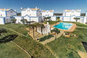 an aerial view of a house with a swimming pool at Casa Alto do Perogil Tavira-3 bedroom house with pool & free wifi in Tavira