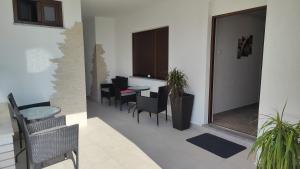 a dining room with chairs and a table and a mirror at Viktor rooms and apartments in Rovinj