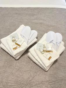 a pair of towels sitting on a bed at Casa Valentina 1 in Perugia +43 photos
