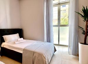 Posteľ alebo postele v izbe v ubytovaní Reinapart Patacona Beachfront Seaview