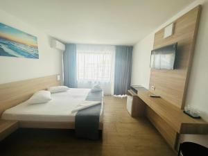 Postel nebo postele na pokoji v ubytování Hotel Gloria