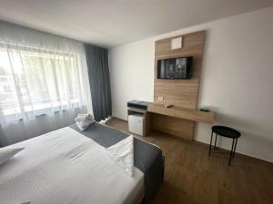 Postel nebo postele na pokoji v ubytování Hotel Gloria