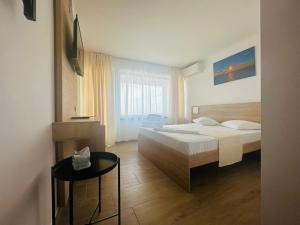 Postel nebo postele na pokoji v ubytování Hotel Gloria
