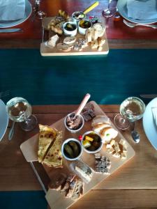 a table with two trays of food on it at La Brousse Kacha in Malleret-Boussac