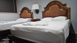 Postel nebo postele na pokoji v ubytování Grand Hotel Colonial Cancun