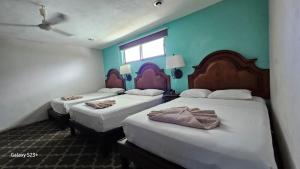 Postel nebo postele na pokoji v ubytování Grand Hotel Colonial Cancun