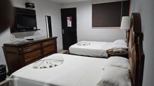 Postel nebo postele na pokoji v ubytování Grand Hotel Colonial Cancun