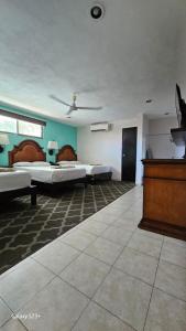 Postel nebo postele na pokoji v ubytování Grand Hotel Colonial Cancun