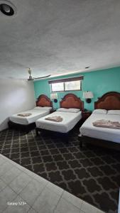 Postel nebo postele na pokoji v ubytování Grand Hotel Colonial Cancun