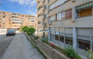 a car parked on a street next to a building at 1 Bedroom Lovely Apartment In Pula in Pula