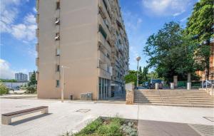 a building with a bench in front of it at 1 Bedroom Lovely Apartment In Pula in Pula